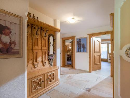 a living room with a large wooden cabinet at Apartments Fleidl in Zell am Ziller
