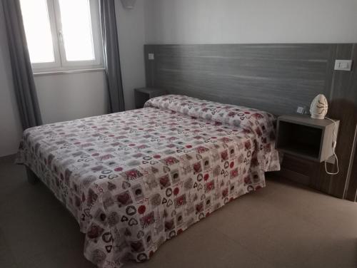Łóżko lub łóżka w pokoju w obiekcie U Ceccenate