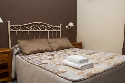 Кровать или кровати в номере Hostal Dulcinea
