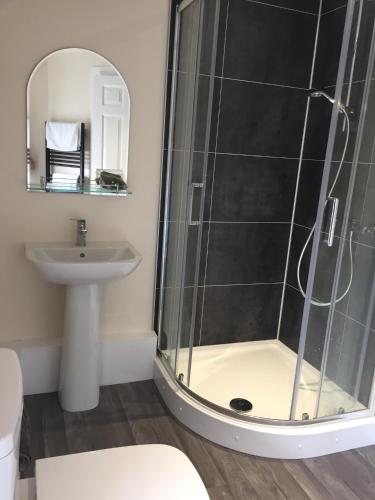 a bathroom with a shower and a sink at Church View in Kirk Yetholm
