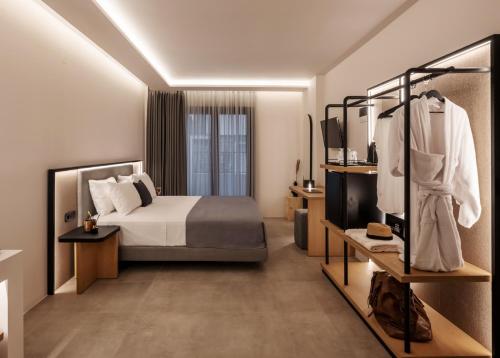 Postel nebo postele na pokoji v ubytování Neapolis 21 Suites, Premium Key Collection