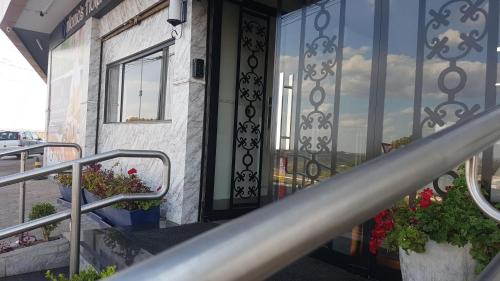 an entrance to a building with a glass door at Antonio's Hotel e Spa - Airport in Brasilia