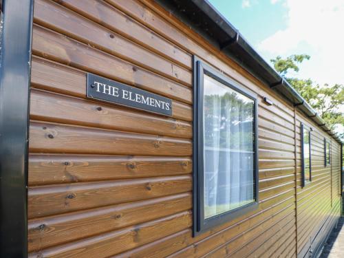 a building with a sign on the side of it at The Elements in Morpeth
