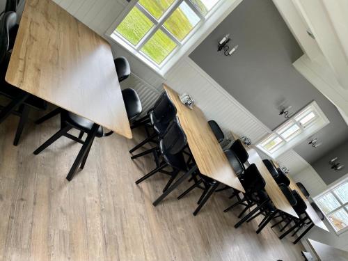 an overhead view of a meeting room with a table and chairs at Ytri Vík in Hauganes