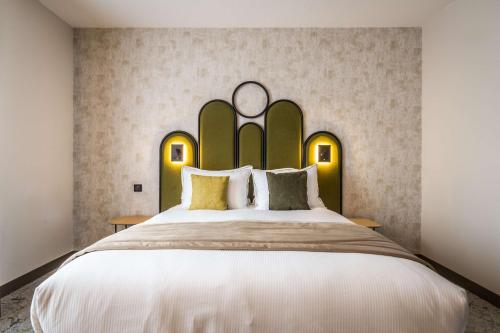 Voodi või voodid majutusasutuse Best Western Le Relais du Vigneron toas