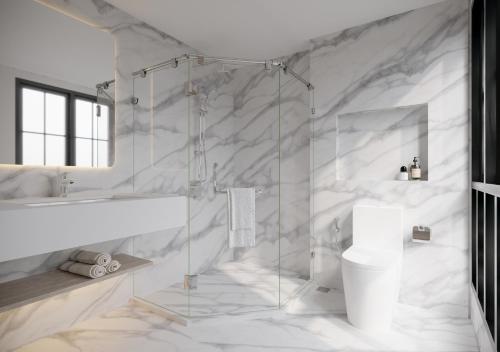 a white bathroom with a shower and a sink at Leon Lasalle Hotel and Residences in Bangkok