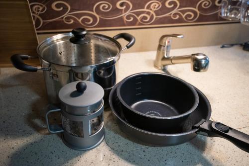 a pot sitting on a counter next to a measuring cup at ペットOK! JUNGLIA 15分! サウナ-プール-Private Villa 405 in Nakijin