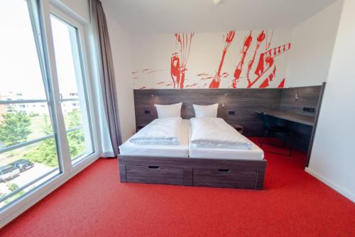 havenhostel Stade - Hotelにあるベッド