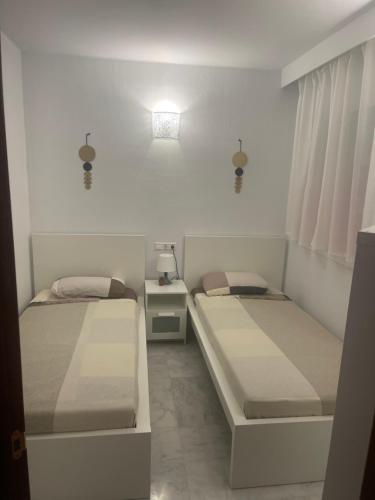 Postel nebo postele na pokoji v ubytování Beach apartament in Torrevieja