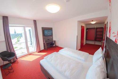 havenhostel Stade - Hotelにあるテレビまたはエンターテインメントセンター