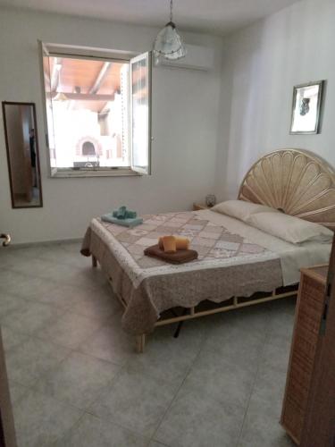 a bedroom with a bed with a tray on it at Villa Gelsomino in Mongiove