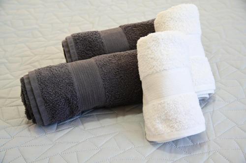 a pair of wrapped up socks on a bed at The desert Pearl in Eilat