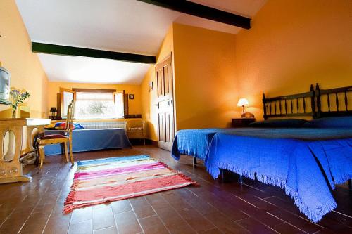 Llit o llits en una habitació de Casa Rural Finca Valvellidos