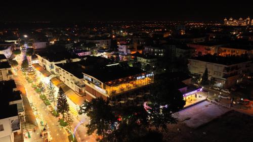 an aerial view of a city at night at Selin Otel Belek in Antalya