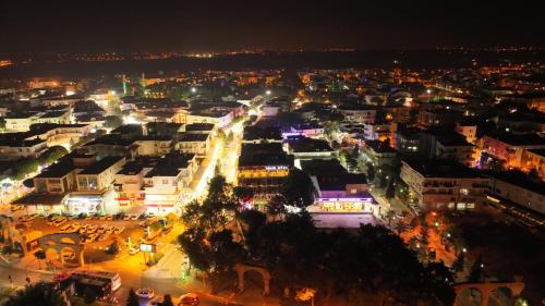 a view of a city at night with lights at Selin Otel Belek in Antalya
