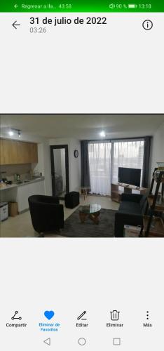 a living room with a couch and a table at Departamento Nuevo Premium Hospedaje Rancagua - Centro in Rancagua