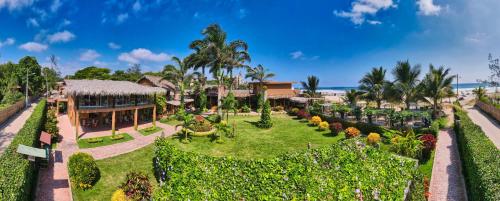 an aerial view of a resort with a garden at Hotel Kundalini in Montañita