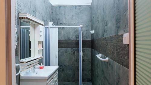 a bathroom with a sink and a shower at SW Home MU **** Mont Choisy in Grand-Baie