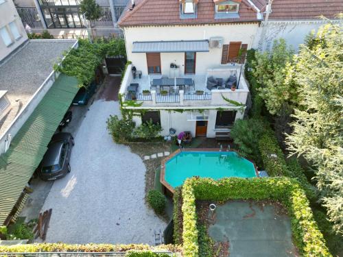 an aerial view of a house with a swimming pool at B&B "Clos Feuillat" in Lyon