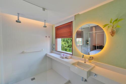 a bathroom with a sink and a mirror at Estalagem Bonfim, 351 in Olinda
