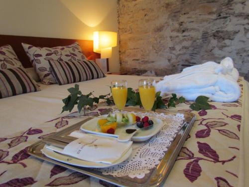 En eller flere senge i et værelse på Hotel Puente de Alconétar