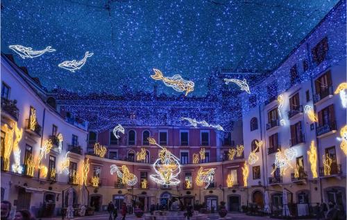 a building decorated with christmas lights and decorations at Nice Apartment In Sant'egidio Del M A in Corbara