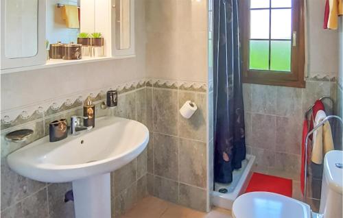 a bathroom with a sink and a shower at Cozy Home In Rojales With Sauna in Rojales