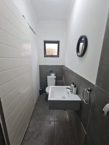 a bathroom with a sink and a toilet at D on 78 in East London