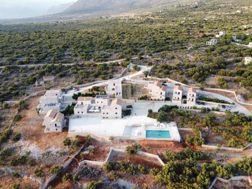 an aerial view of a villa with a swimming pool at Koukouri Village in Kafióna