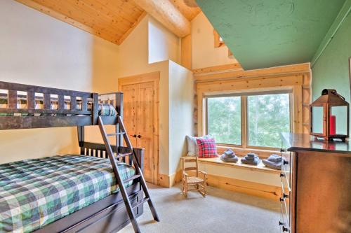 a bedroom with a bunk bed and a window at 22STR-00506 Fairplay Log Cabin 26 Mi to Breck! in Fairplay