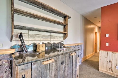 a kitchen with a sink and a mirror at 22STR-00506 Fairplay Log Cabin 26 Mi to Breck! in Fairplay