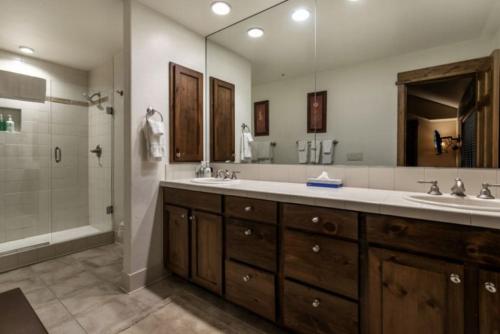 a large bathroom with two sinks and a shower at 3 Bedroom In Lionshead Village At The Antlers in Vail