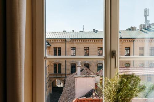 a view of a building from a window at Bogoria Residence - LoftAffair Collection in Kraków