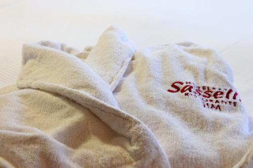 a close up of a sweatshirt with a red writing on it at Hotel Sassella in Grosio