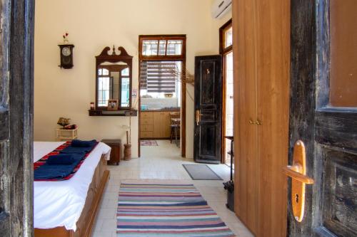 a bedroom with a bed and a mirror at BREAD HOUSE in Bethlehem