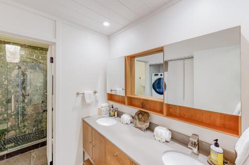 a bathroom with two sinks and a mirror at Sun & Ski in Sun Valley