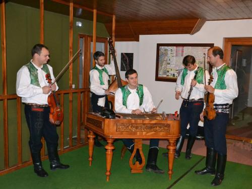 a group of men standing around a table with instruments at Penzion Pod Vápenkami in Strážnice