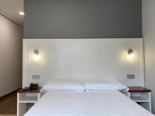 Postel nebo postele na pokoji v ubytování Hotel Arsus