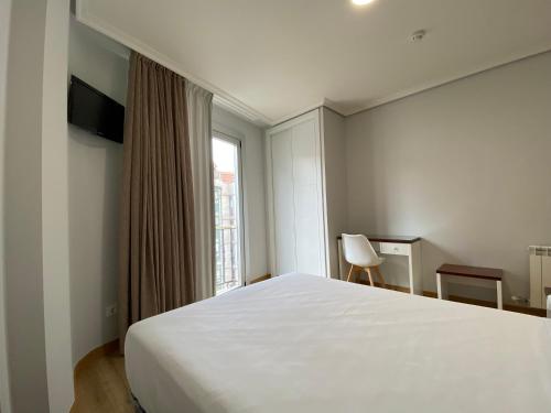 TV a/nebo společenská místnost v ubytování Hotel Arsus