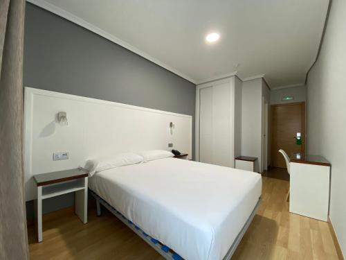 Postel nebo postele na pokoji v ubytování Hotel Arsus