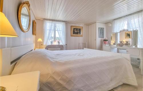 a bedroom with a large white bed in a room at Nice Home In sa With Kitchen in Åsa