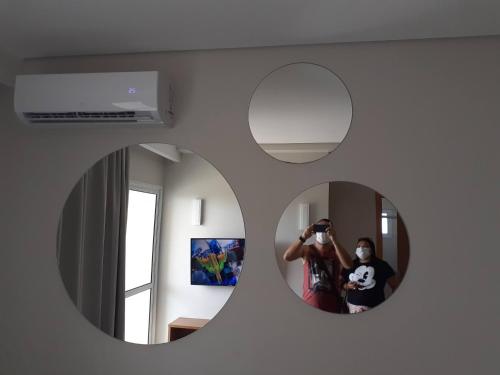 a man taking a picture of himself in a mirror at Salinas exclusive Ary Costa in Salinópolis