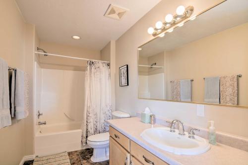 a bathroom with a sink and a toilet and a tub at Charming Barn Apt in Boulder! Gateway to Parks! in Boulder Town