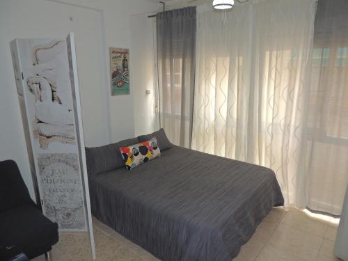 Ένα ή περισσότερα κρεβάτια σε δωμάτιο στο Estudio en playa de Fuengirola wifi