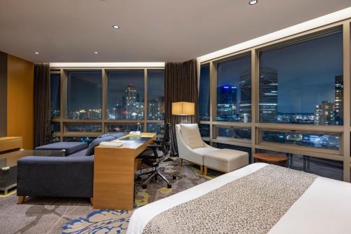 a hotel room with a view of a city at Holiday Inn Incheon Songdo by IHG in Incheon