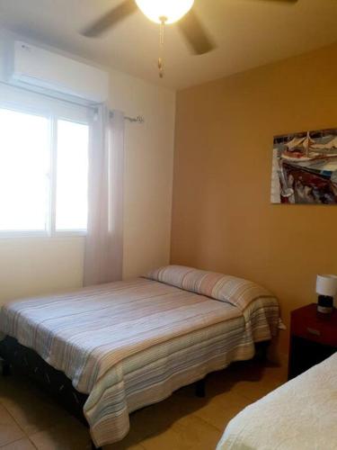 Voodi või voodid majutusasutuse Hermoso Apartamento toas