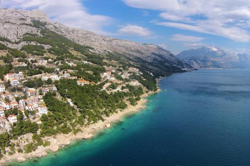 an aerial view of an island in the water at Apartments with a parking space Marusici, Omis - 1041 in Mimice