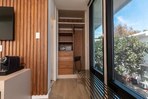 a hallway with a large window and a tv at Park Plaza Lodge in Los Angeles
