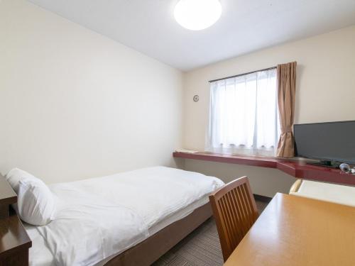TV a/nebo společenská místnost v ubytování Tabist Rays Hotel Suisen