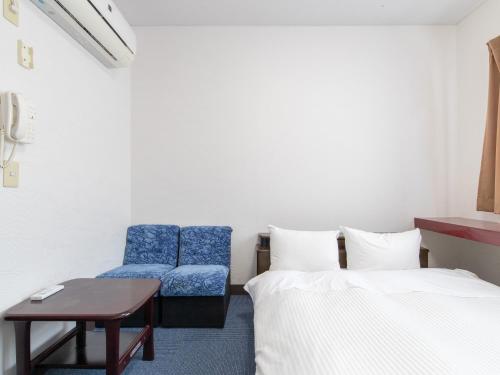 Postel nebo postele na pokoji v ubytování Tabist Rays Hotel Suisen